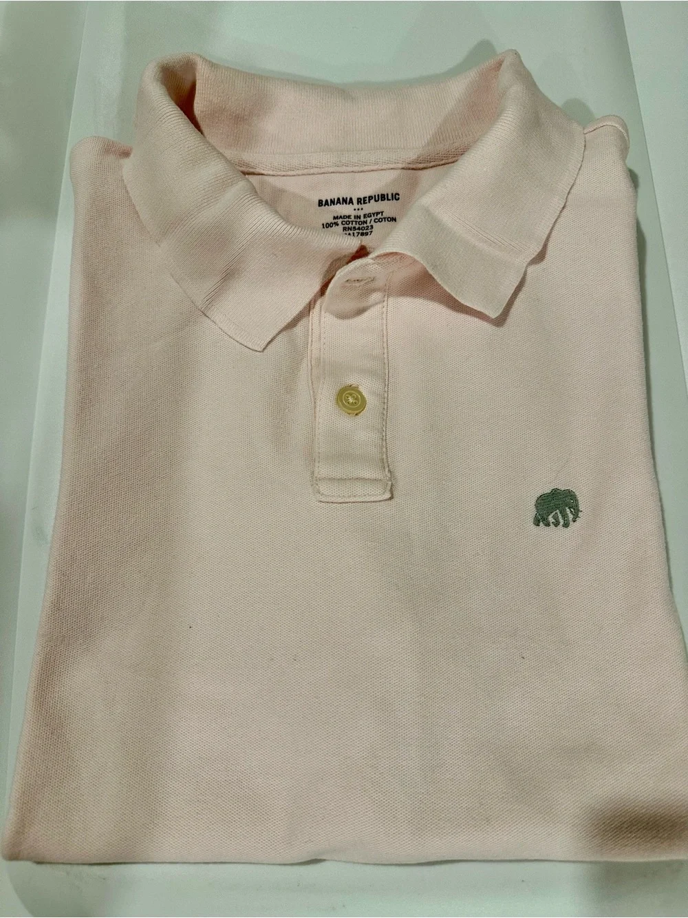 Banana Republic men’s polo in light pink, with gray elephant logo, size L